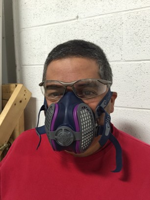 Worker wearing half-face respirator
